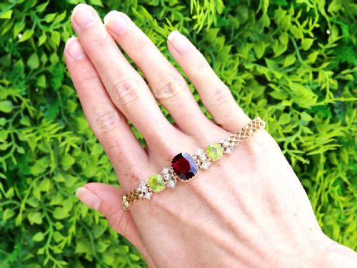 ANTIQUE 517CT GARNET 310CT PERIDOT AND 049CT DIAMOND 15CT YELLOW GOLD BRACELET CIRCA 1910 - ADDITIONAL PHOTO 1