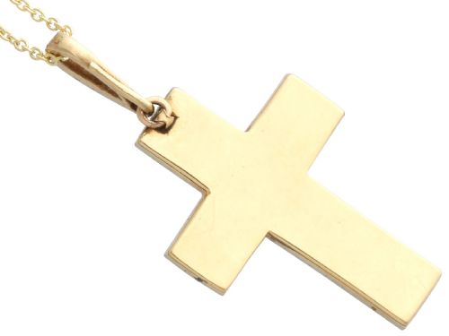 fig 5. An antique Victorian cross pendant featuring cobalt blue enamel framed by small diamonds set in metal atop a 15ct yellow gold backing.