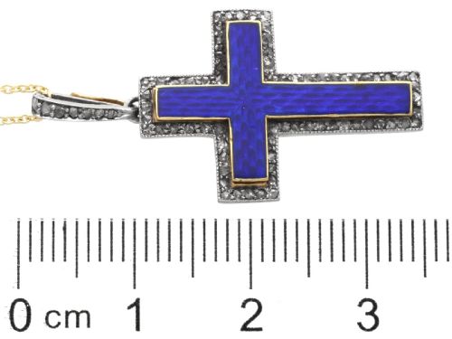 fig 6. An antique Victorian cross pendant featuring cobalt blue enamel framed by small diamonds set in metal atop a 15ct yellow gold backing.