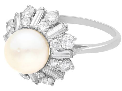 fig 4. A platinum cluster ring featuring a central white cultured pearl surrounded by a starburst halo of baguette and brilliant-cut diamonds.
