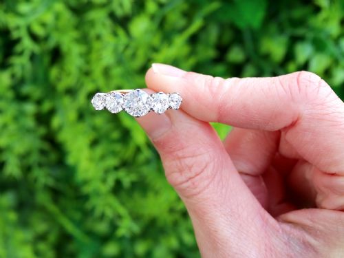 fig 1. An 18ct yellow gold five stone ring set with five graduated round diamonds in claw settings.
