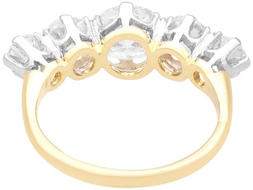 fig 5. An 18ct yellow gold five stone ring set with five graduated round diamonds in claw settings.
