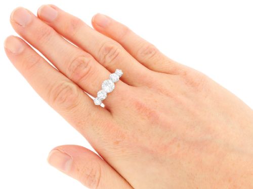 fig 7. An 18ct yellow gold five stone ring set with five graduated round diamonds in claw settings.