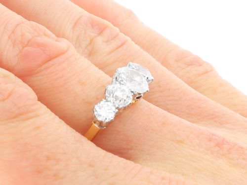 fig 8. An 18ct yellow gold five stone ring set with five graduated round diamonds in claw settings.
