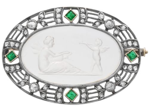ANTIQUE CRYSTAL 014CT EMERALD 058CT DIAMOND AND 18CT YELLOW GOLD CUPID AND PSYCHE BROOCH CIRCA 1880