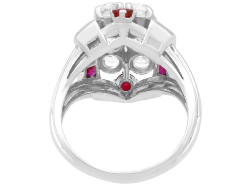 fig 4. An Art Deco 18ct white gold dress ring featuring a central cluster of old-cut diamonds flanked by channel-set calibre rubies.