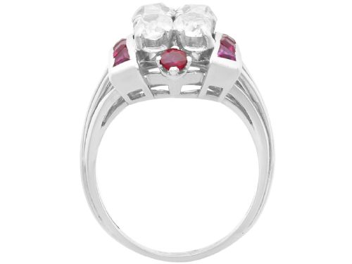 fig 5. An Art Deco 18ct white gold dress ring featuring a central cluster of old-cut diamonds flanked by channel-set calibre rubies.