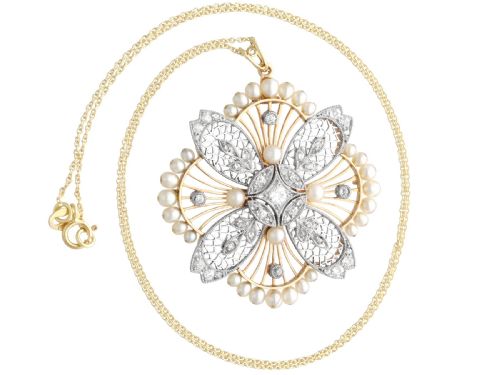 fig 4. An openwork circular Edwardian floral pendant brooch crafted in rose gold and platinum, set with central diamonds and a perimeter of natural pearls.