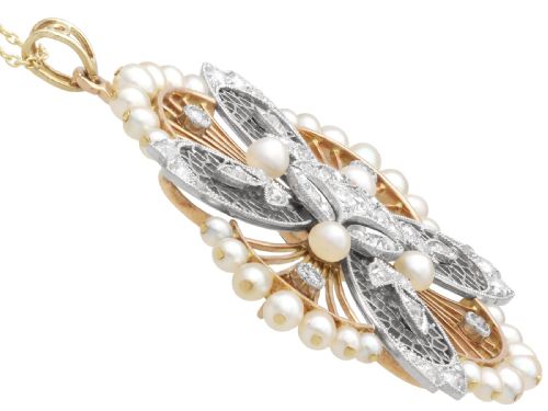 fig 6. An openwork circular Edwardian floral pendant brooch crafted in rose gold and platinum, set with central diamonds and a perimeter of natural pearls.