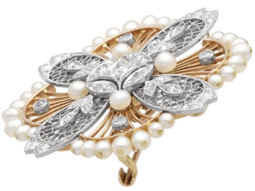 fig 7. An openwork circular Edwardian floral pendant brooch crafted in rose gold and platinum, set with central diamonds and a perimeter of natural pearls.