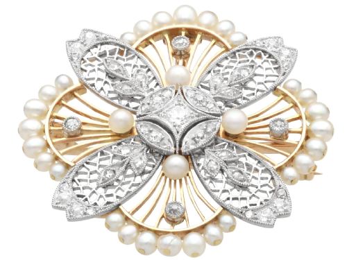 fig 8. An openwork circular Edwardian floral pendant brooch crafted in rose gold and platinum, set with central diamonds and a perimeter of natural pearls.