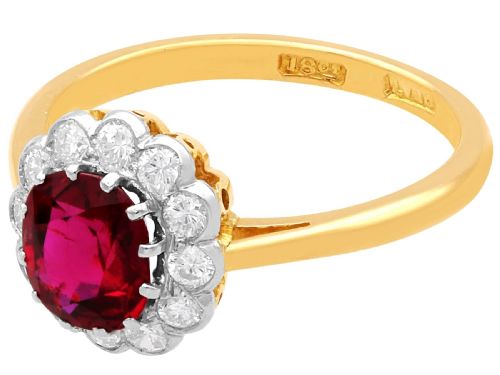 fig 4. An 18ct yellow gold cluster ring featuring a central cushion cut red ruby framed by a halo of round diamonds.