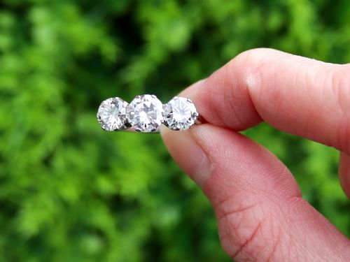 fig 1. A vintage 18ct white gold trilogy ring featuring three round brilliant cut diamonds set in claw settings.