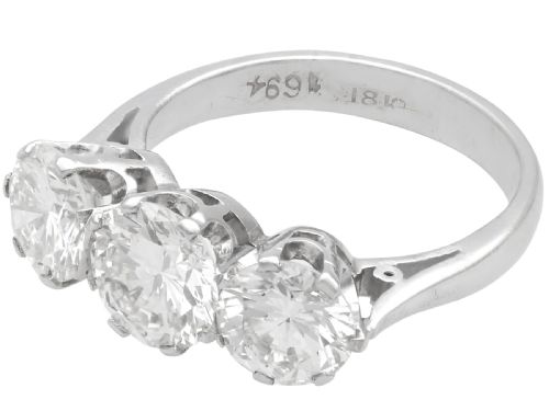 fig 3. A vintage 18ct white gold trilogy ring featuring three round brilliant cut diamonds set in claw settings.