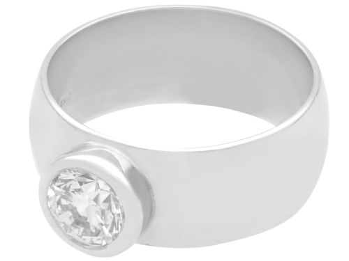 fig 2. A vintage 14ct white gold wide band ring featuring a central bezel-set round brilliant diamond.
