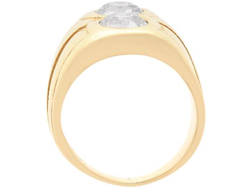 fig 5. A wide 14ct yellow gold ring featuring two round diamonds set vertically within carved linear accents.