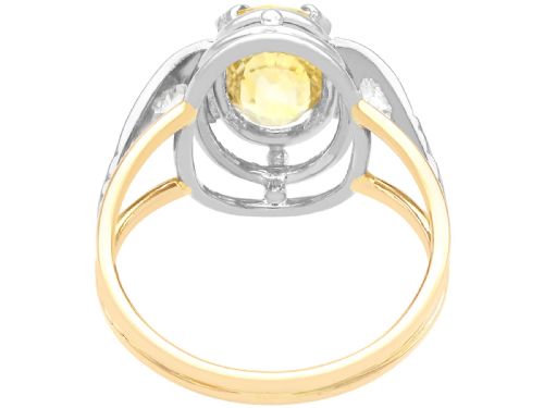 fig 6. An Art Deco 18ct yellow gold and platinum ring featuring a central oval yellow sapphire flanked by single diamonds.