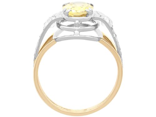 fig 7. An Art Deco 18ct yellow gold and platinum ring featuring a central oval yellow sapphire flanked by single diamonds.