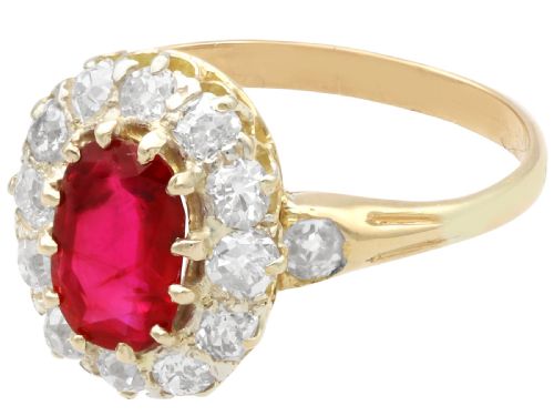 fig 4. An 18ct yellow gold ring featuring a central oval faceted ruby surrounded by a halo of twelve old cut diamonds in claw settings.