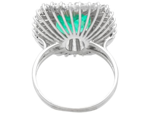 fig 4. A 1950s platinum ballerina ring featuring a central rectangular emerald surrounded by a radiating fan of channel-set baguette cut diamonds.