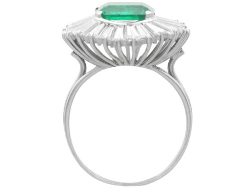 fig 5. A 1950s platinum ballerina ring featuring a central rectangular emerald surrounded by a radiating fan of channel-set baguette cut diamonds.