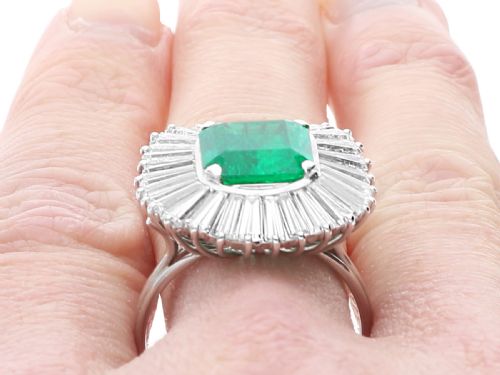 fig 8. A 1950s platinum ballerina ring featuring a central rectangular emerald surrounded by a radiating fan of channel-set baguette cut diamonds.