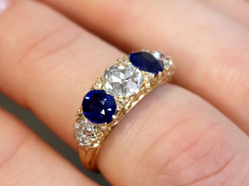 fig 2. An antique 18ct yellow gold five stone ring set with alternating blue sapphires and old-cut diamonds.