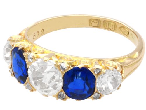 fig 4. An antique 18ct yellow gold five stone ring set with alternating blue sapphires and old-cut diamonds.