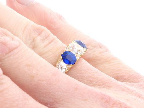 fig 8. An antique 18ct yellow gold five stone ring set with alternating blue sapphires and old-cut diamonds.