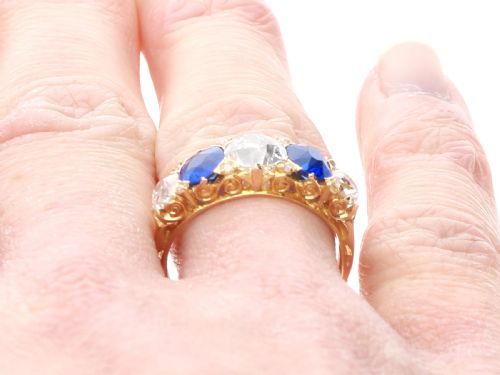 fig 9. An antique 18ct yellow gold five stone ring set with alternating blue sapphires and old-cut diamonds.