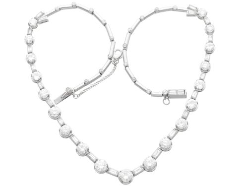 fig 5. An antique Art Deco platinum necklace set with alternating round cut and baguette cut diamonds linked in a continuous line.