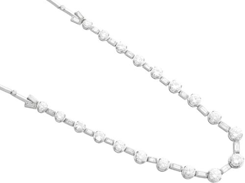 fig 6. An antique Art Deco platinum necklace set with alternating round cut and baguette cut diamonds linked in a continuous line.