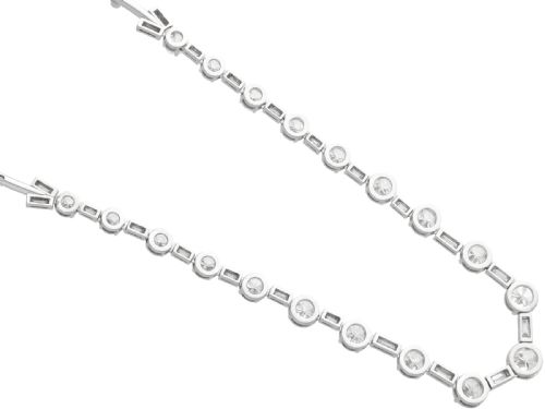 fig 8. An antique Art Deco platinum necklace set with alternating round cut and baguette cut diamonds linked in a continuous line.