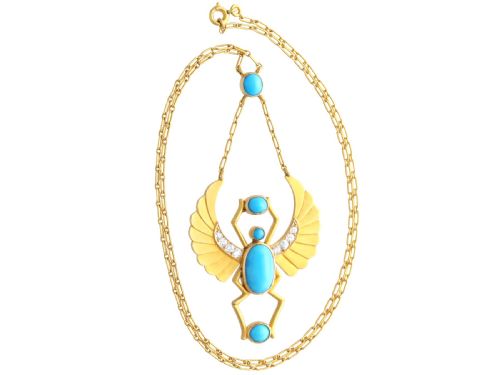 fig 5. An 18ct yellow gold Egyptian Revival pendant crafted in the shape of a winged scarab beetle with turquoise cabochons and set with diamonds.