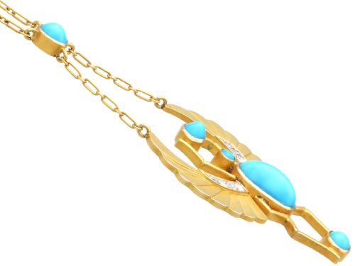 fig 7. An 18ct yellow gold Egyptian Revival pendant crafted in the shape of a winged scarab beetle with turquoise cabochons and set with diamonds.