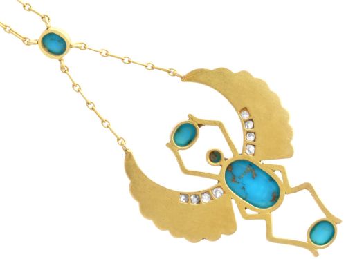 fig 8. An 18ct yellow gold Egyptian Revival pendant crafted in the shape of a winged scarab beetle with turquoise cabochons and set with diamonds.