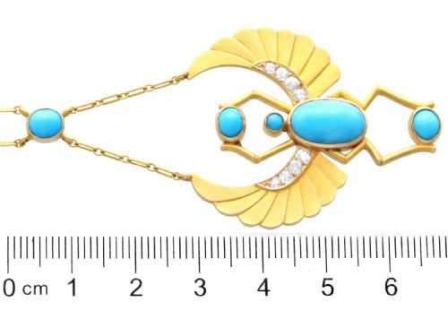fig 9. An 18ct yellow gold Egyptian Revival pendant crafted in the shape of a winged scarab beetle with turquoise cabochons and set with diamonds.