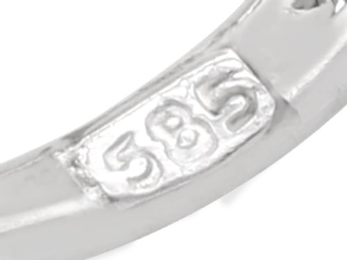 fig 6. A pair of 14ct white gold twirl earrings featuring round brilliant cut diamonds set in a concentric spiral design around a central diamond.
