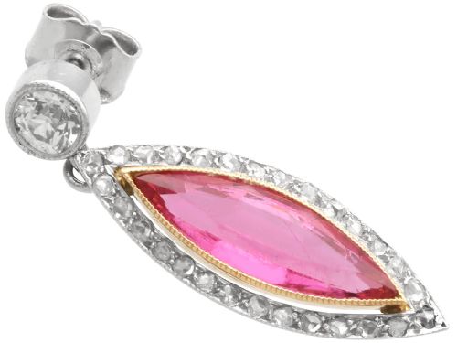 fig 4. Pair of Art Deco platinum drop earrings featuring navette-cut pink tourmalines bordered by small diamonds, suspended from round diamond studs.