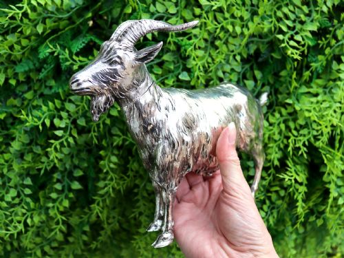 fig 1. An antique German sterling silver sugar box realistically sculpted in the shape of a standing goat with textured fur and curved horns.