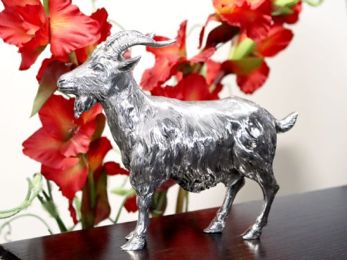 fig 2. An antique German sterling silver sugar box realistically sculpted in the shape of a standing goat with textured fur and curved horns.