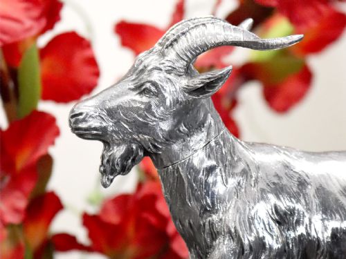 fig 3. An antique German sterling silver sugar box realistically sculpted in the shape of a standing goat with textured fur and curved horns.