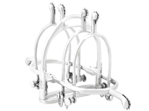 fig 4. An antique sterling silver toast rack designed with equestrian riding spurs and rowels.