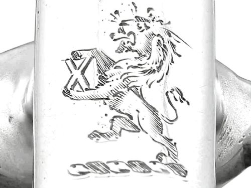 fig 6. An antique sterling silver toast rack designed with equestrian riding spurs and rowels.