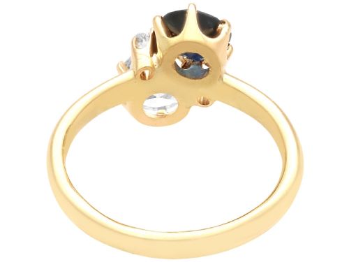 fig 5. An antique 14ct yellow gold ring featuring an oval blue sapphire paired with a round diamond and small accent stones in claw settings.