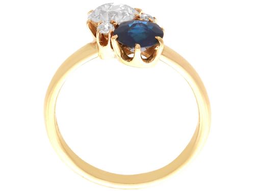fig 6. An antique 14ct yellow gold ring featuring an oval blue sapphire paired with a round diamond and small accent stones in claw settings.