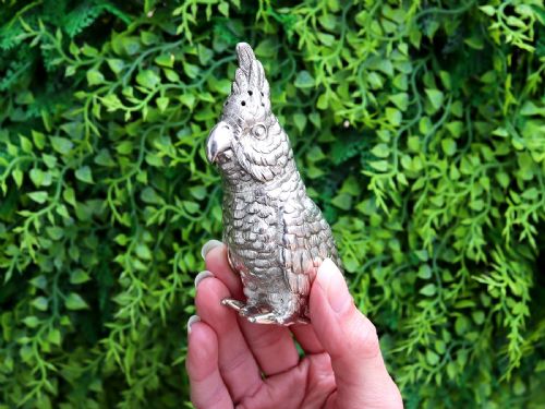 fig 2. A Victorian sterling silver pepperette cast in the detailed likeness of a cockatoo with pierced holes along its crest.
