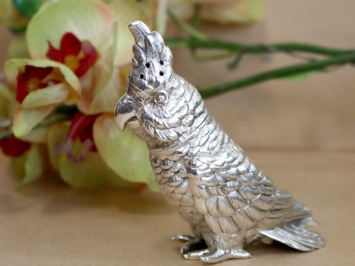 fig 4. A Victorian sterling silver pepperette cast in the detailed likeness of a cockatoo with pierced holes along its crest.