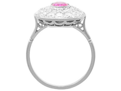 fig 7. An 18ct white gold halo ring featuring a central oval red ruby surrounded by two tiers of round diamonds.