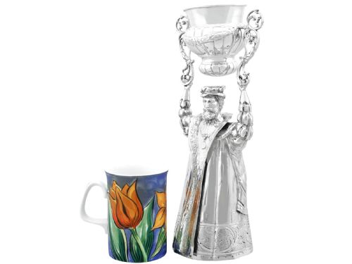 fig 7. A Victorian sterling silver wager cup depicting a bearded male figure holding a double-handled vessel above his head.